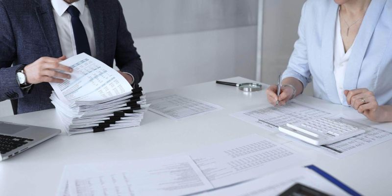 Man and woman reviewing documents for a law