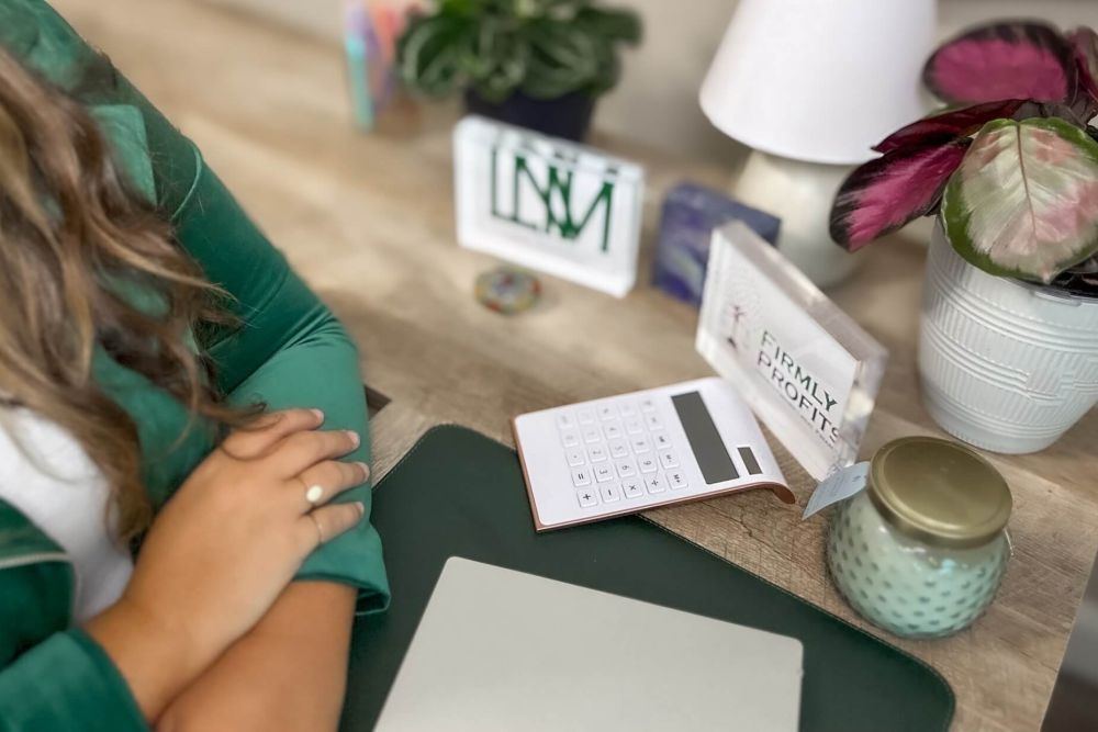 Leah N. Miller Owner at her desk