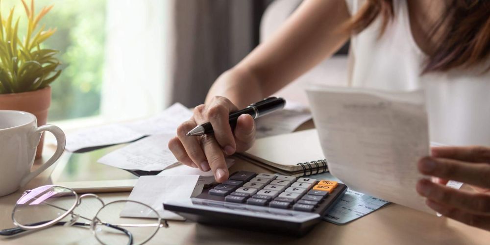 Woman reviewing financial data for fractional CFO services