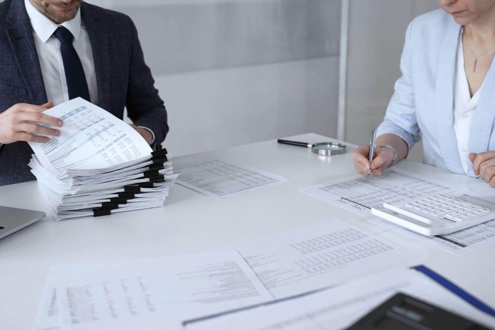 Man and woman reviewing documents for a law