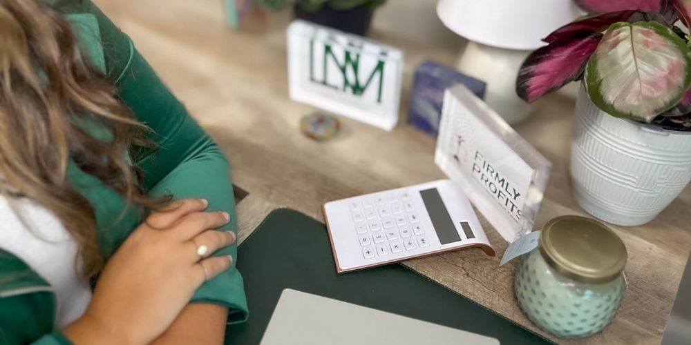 Leah N. Miller Owner at her desk
