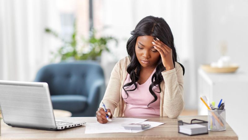Woman working on laptop at a desk