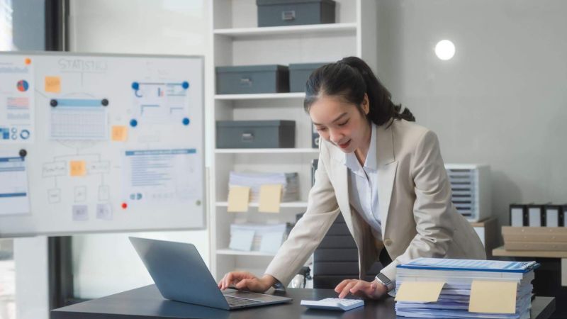 Woman using a laptop to manage a law firm chart